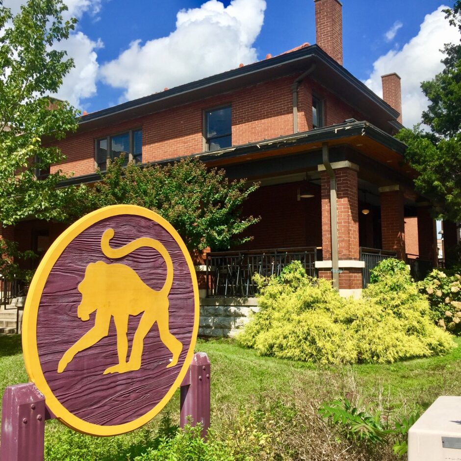 Exterior photo of coffee shop in an old brick home.