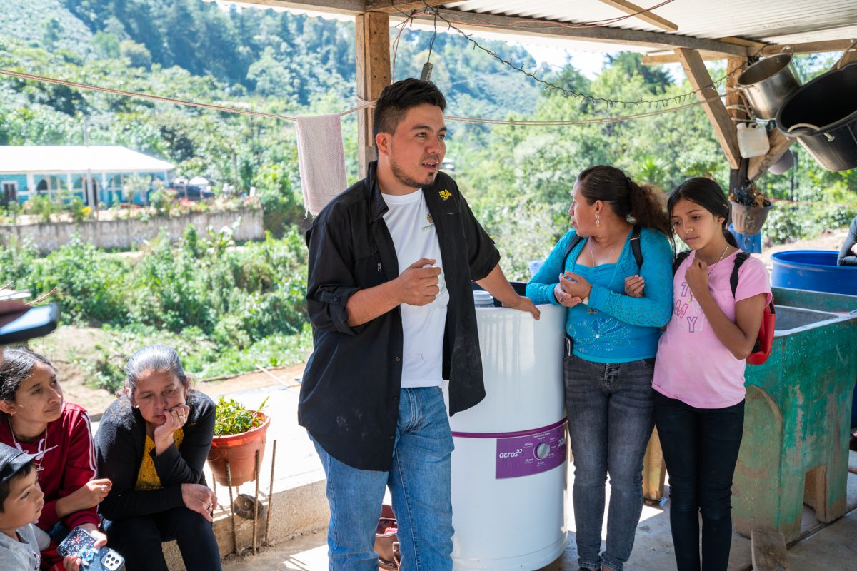 Coffee Farmer in Guatemala speaking to visitors
