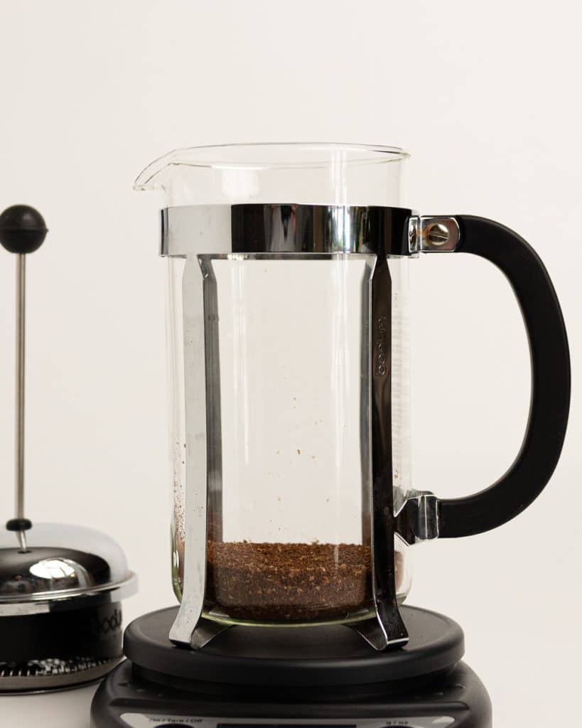 grounds in the bottom of a French press base on a scale